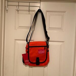 NWT Manhattan Portage Urban Orange Crossbody Bag 
Item 1407 TWCH-6436US